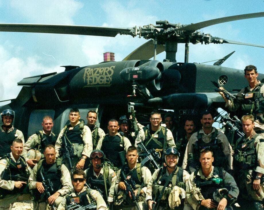 Combat Search and Rescue team photographed with a Black Hawk helicopter, Mogadishu, 1993.